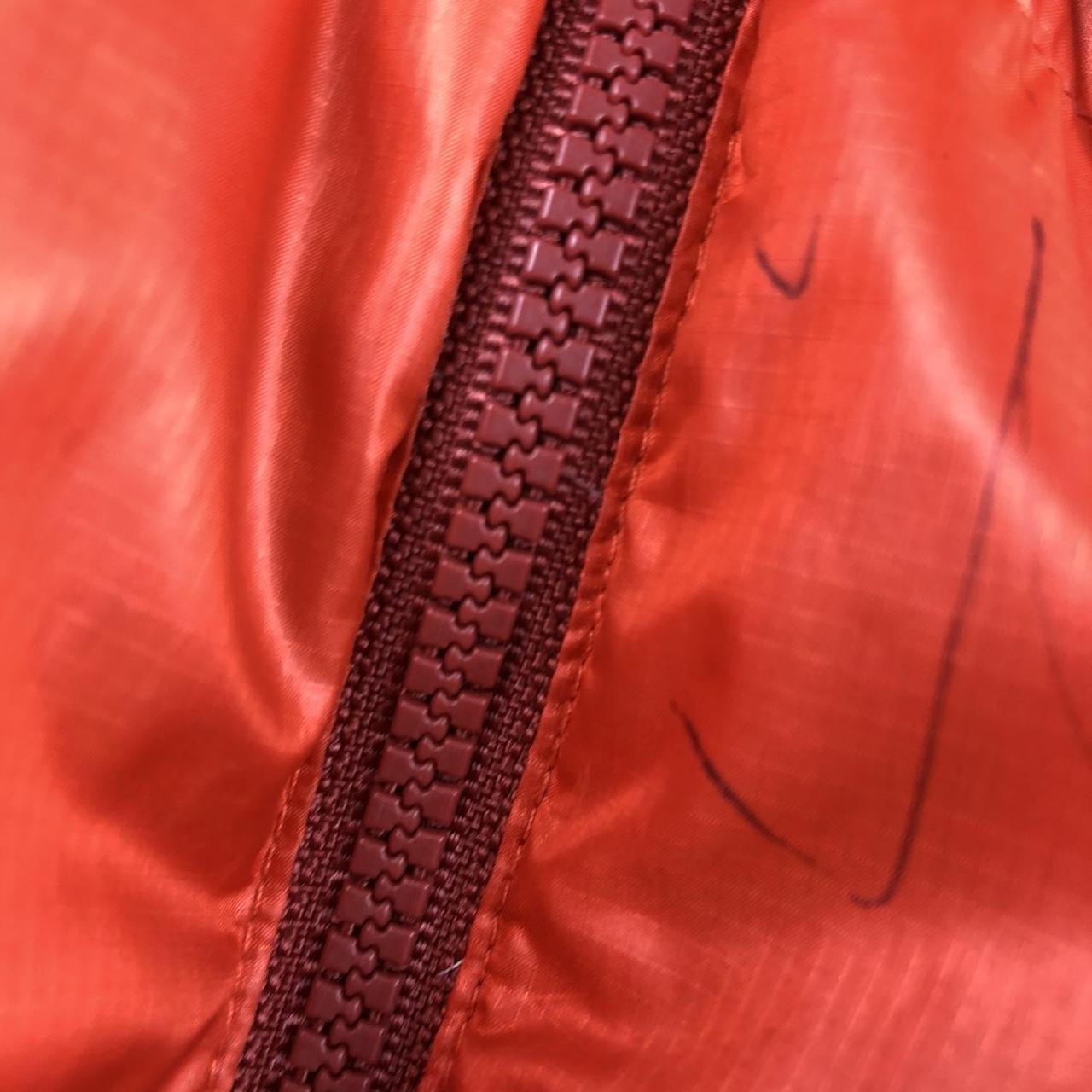 Orange two tone montbell puffer
